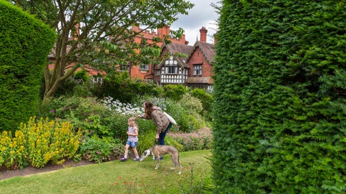 Visitors exploring the garden at Wightwick Manor and Gardens, West Midlands